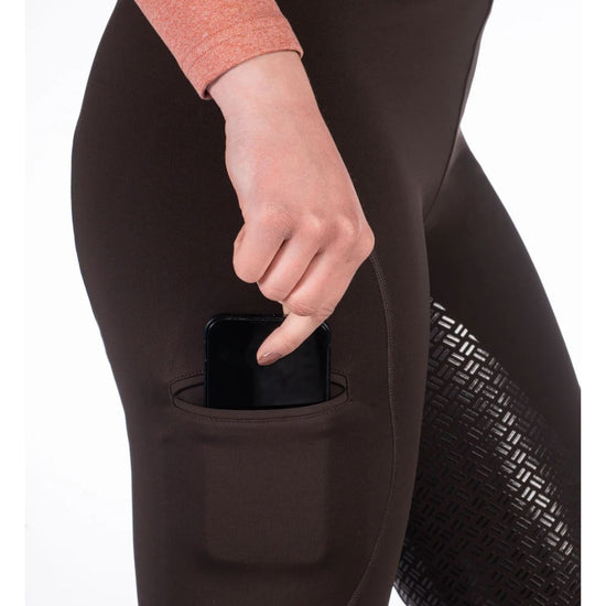 woman wearing black HKM Rio Full Seat Riding Tights on white background