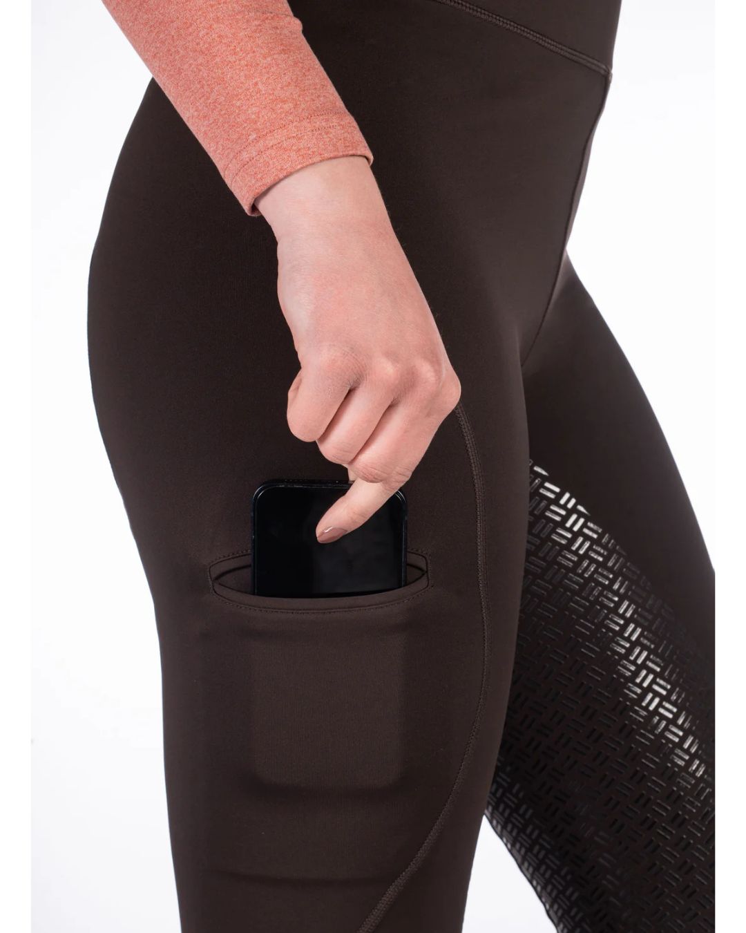 woman wearing black HKM Rio Full Seat Riding Tights on white background