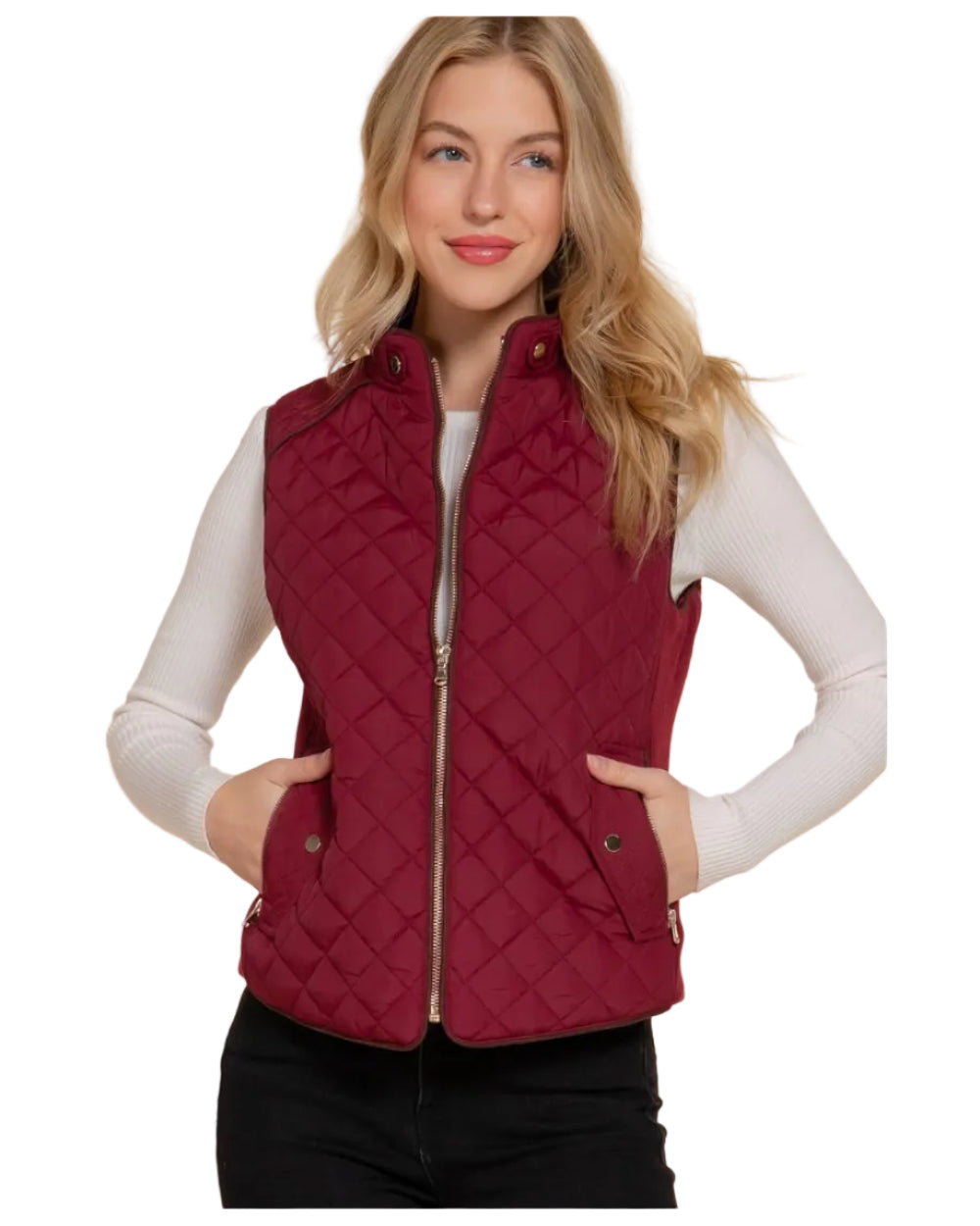 Woman wearing a red burgundy quilted vest against a white background equestrian fashion outfitters