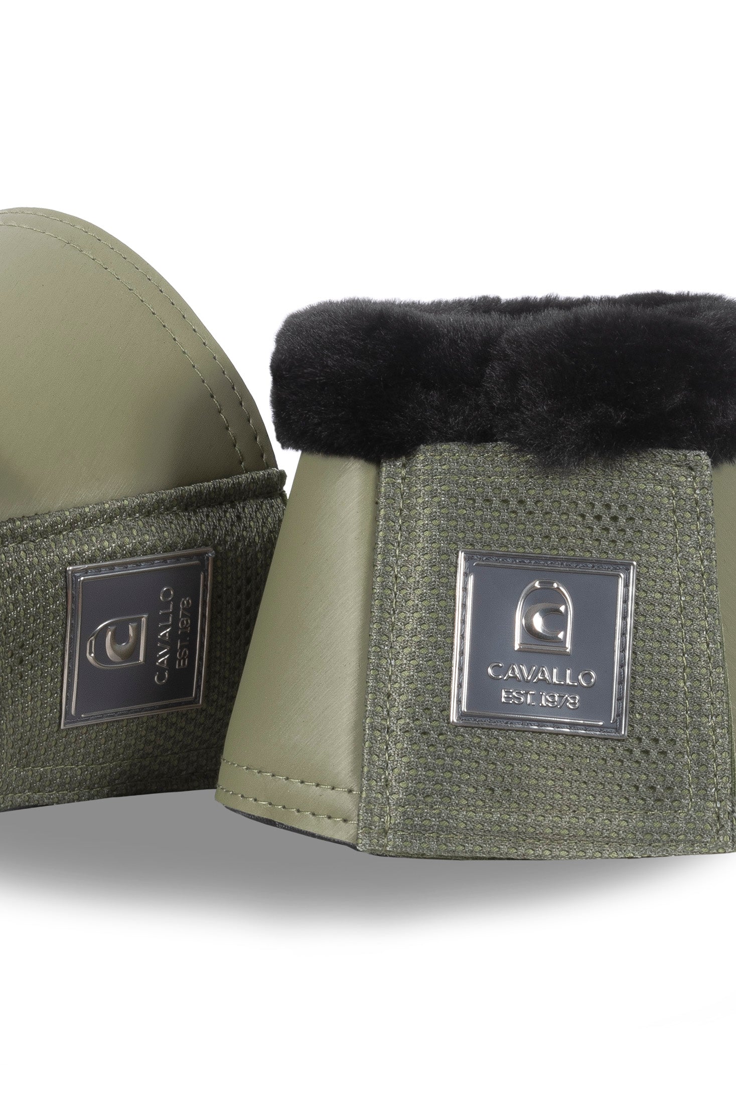 Green equestrian bell boots with black fur lining on a white background