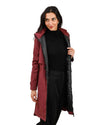 Woman wearing a long red and black rain coat on a white background equestrian fashion outfitters