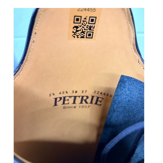 Close-up the 'Petrie' brand name and equestrian fashion outfitters