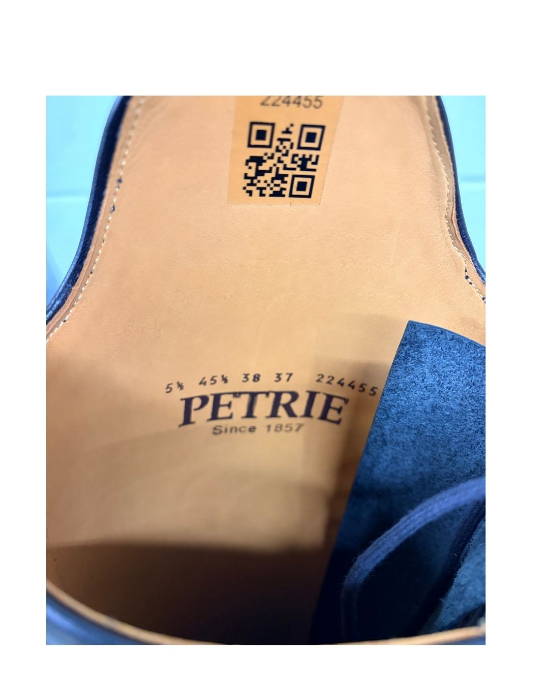 Close-up the 'Petrie' brand name and equestrian fashion outfitters
