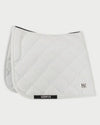 White quilted saddle pad with a brand logo on a white background
