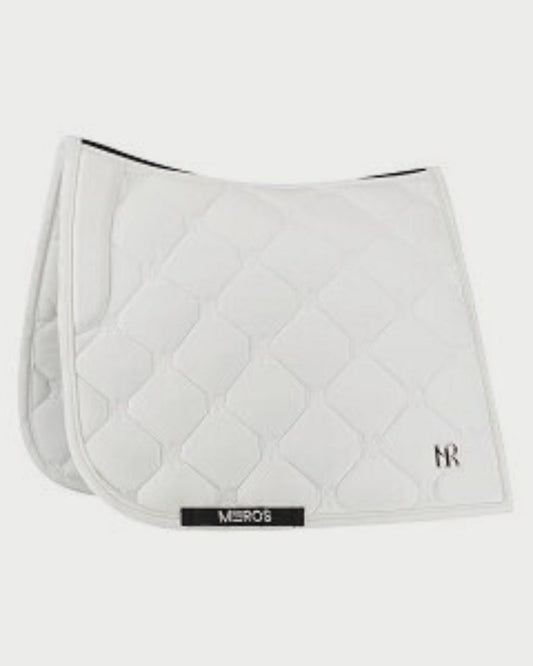 White quilted saddle pad with a brand logo on a white background