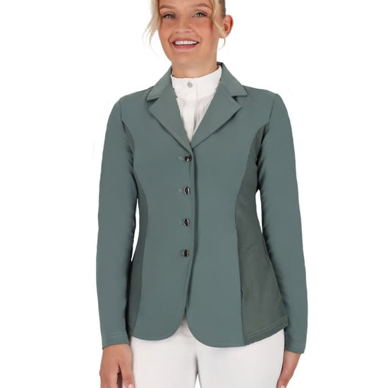 Woman wearing a green equestrian jacket on a white background equestrian fashion outfitters