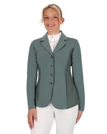 Woman wearing a green equestrian jacket on a white background equestrian fashion outfitters