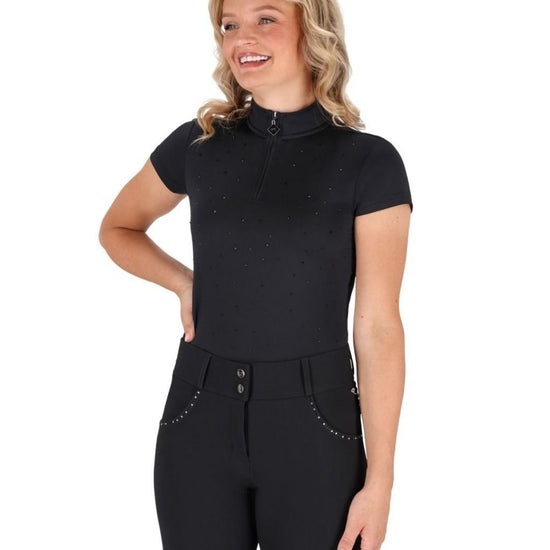 Woman wearing a black qhp training shirt short sleeve outfit with a white background equestrian fashion outfitters