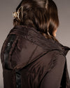 close up of back of woman HKM Lauria Garrelli Arezzo Long Vest in brown on grey background