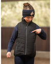 Child wearing HKM Childrens Black heated vest with logo on a white background - equestrian fashion outfitters