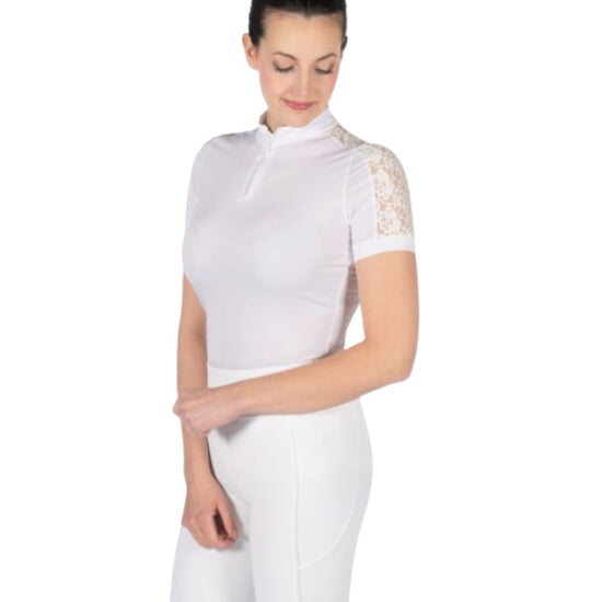 Woman wearing a white equestrian show shirt with lace sleeves on a white background