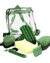 Set of green grooming tools including brushes and a bag on a white background