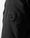 Black jacket with a logo patch on a white background