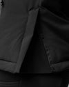 Close-up of a black jacket with a side zipper