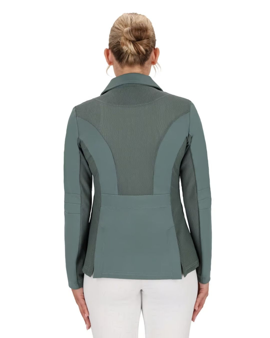 Person wearing a green equestrian jacket on a white background equestrian fashion outfitters