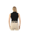 Woman wearing beige riding pants with a black belt and black sleeveless polo on a white background equestrian fashion outfitters