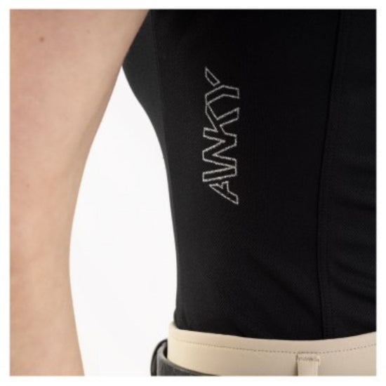 Black sleeveless top with 'ANKY' branding on a person wearing beige breeches pants. equestrian fashion outfitters