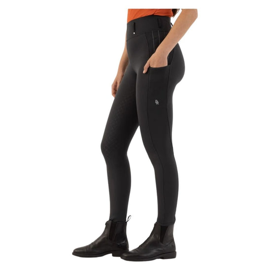 Person wearing black riding pants on a white background Black riding pants worn by a person on a white background equestrian fashion outfitters