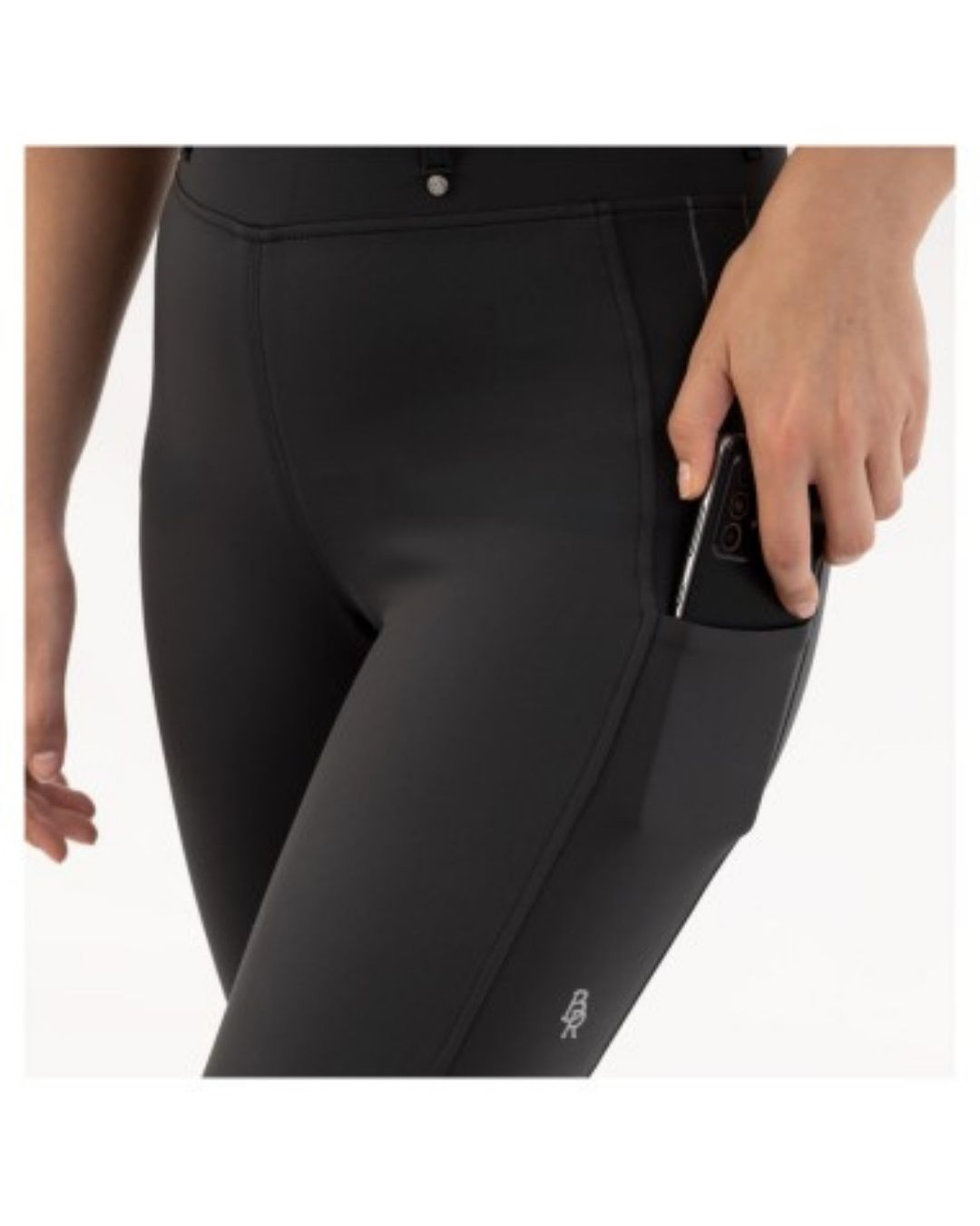 Black riding pants worn by a person on a white background equestrian fashion outfitters