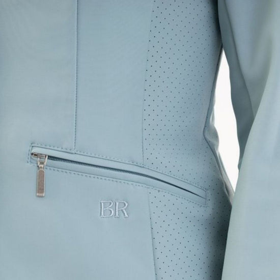 Woman wearing a light blue blazer show jacket Kendra on a white background equestrian Fashion Outfitters