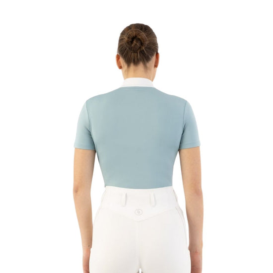 Woman wearing a light blue top with mesh panels BR Koosje on a white background Equestrian Fashion Outfitters