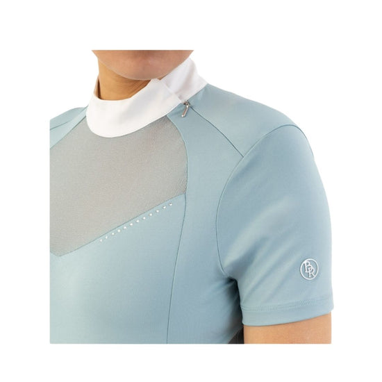 Woman wearing a light blue top with mesh panels BR Koosje on a white background Equestrian Fashion Outfitters