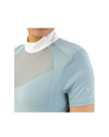Woman wearing a light blue top with mesh panels BR Koosje on a white background Equestrian Fashion Outfitters
