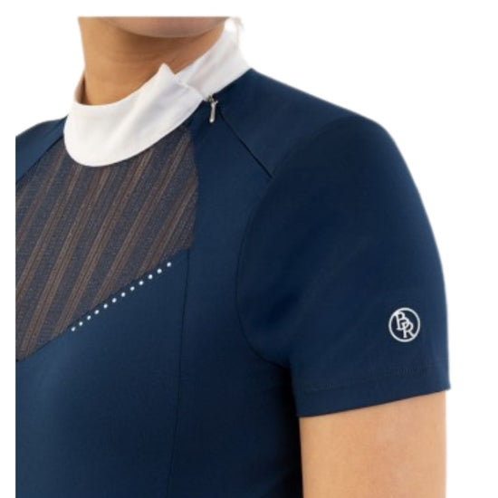 Woman wearing a navy equestrian shirt with a white collar and mesh detail BR Koosje on a white background equestrian fashion outfitters
