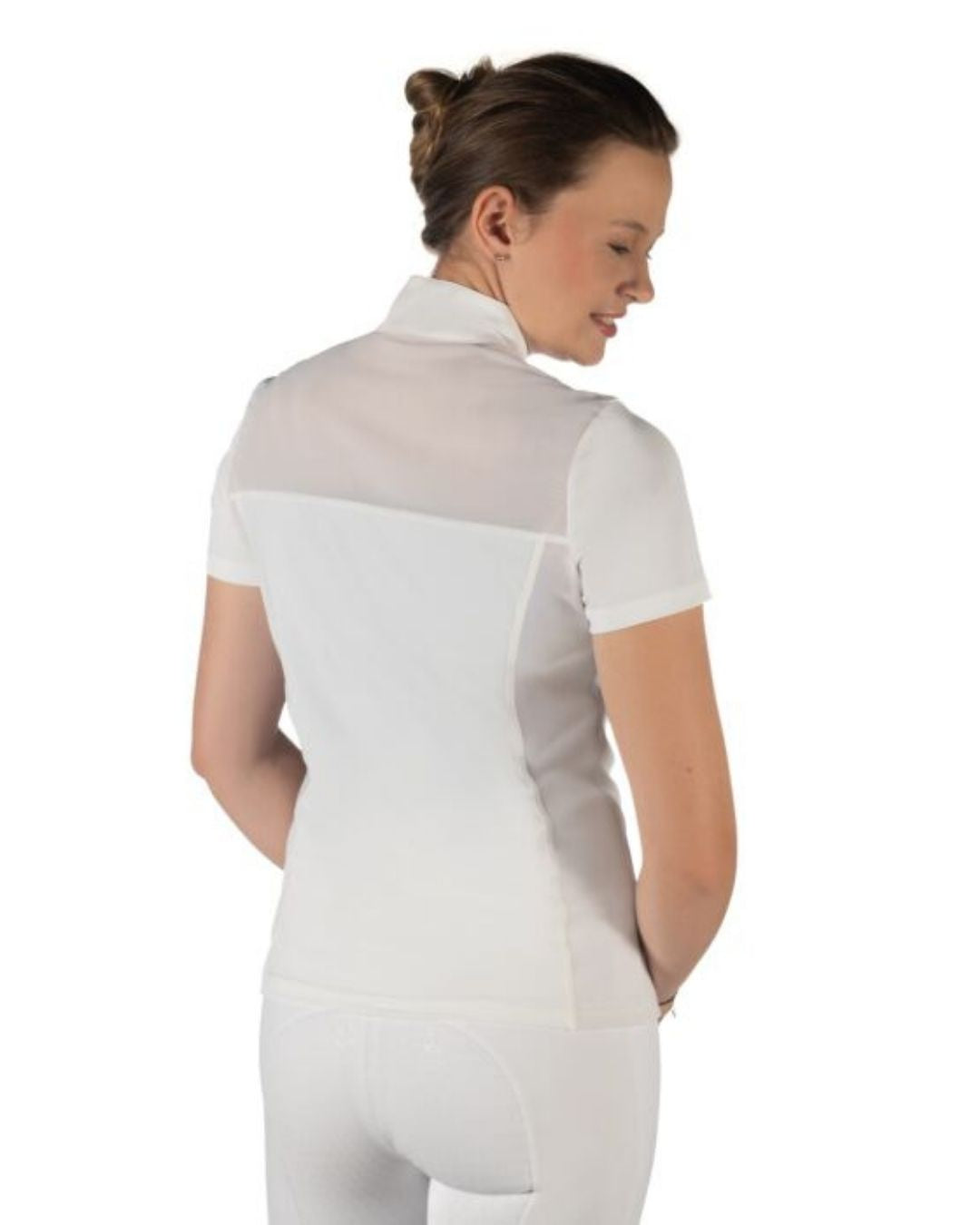 Woman wearing a white equestrian shirt on a white background Equestrian fashion outfitters