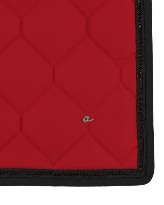 Red quilted mat with black border on a white background
