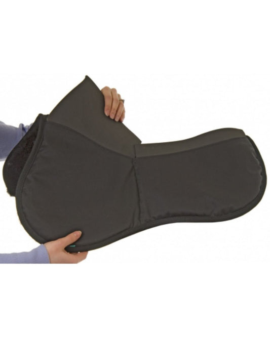 Person holding a black saddle pad against a white background