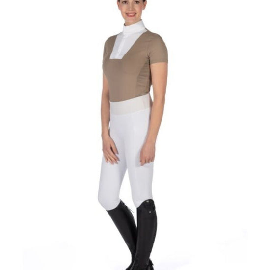 Woman wearing a brown top, white pants, and black riding boots on a white background Equestrian fashion outfitters