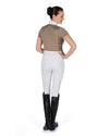 Person wearing a brown shirt, white pants, and black riding boots on a white background Equestrian fashion outfitters