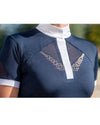 Navy blue top with white collar and geometric embroidery on a blurred outdoor background Equestrian fashion outfitters
