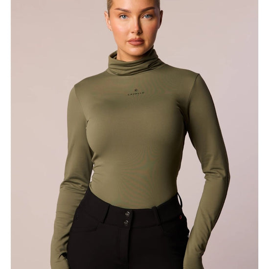 Woman wearing an olive green long-sleeve top with a brand logo cavallo on a beige background