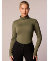Woman wearing an olive green long-sleeve top with a brand logo cavallo on a beige background