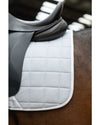 close up of black saddle with HKM Glitter mesh quilted white saddle pad on a horse 
