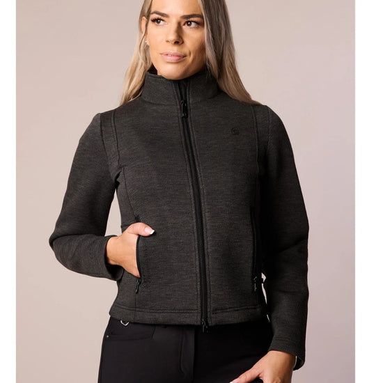 Woman wearing black-dark grey jacket against a neutral background