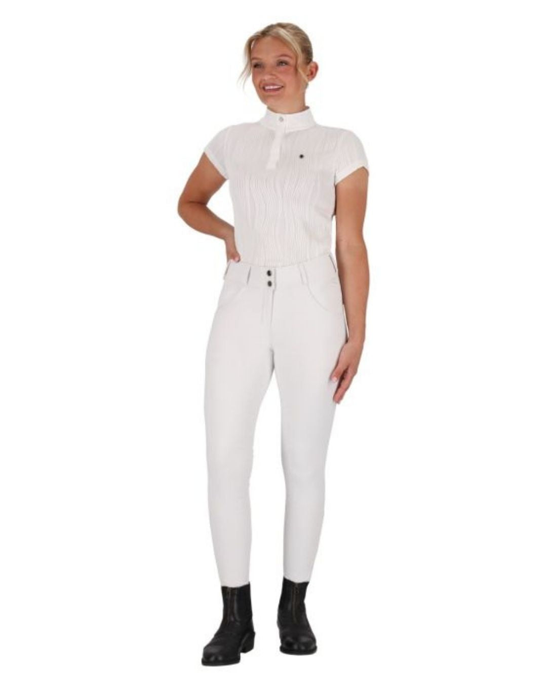 Woman wearing a white e qhp kynlee short sleeve shirt  equestrian fashion outfitters