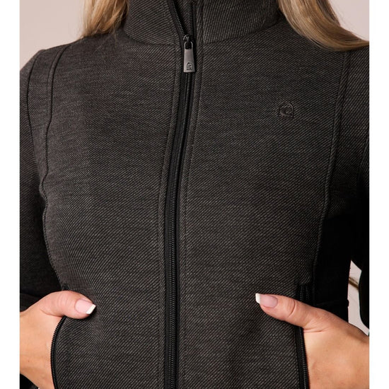 Person wearing a black dark grey zip-up jacket with a visible brand logo on a neutral background