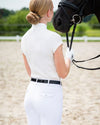 Woman in equestrian qhp show shirt short sleeve standing next to a horse in an outdoor setting equestrian fashion outfitters