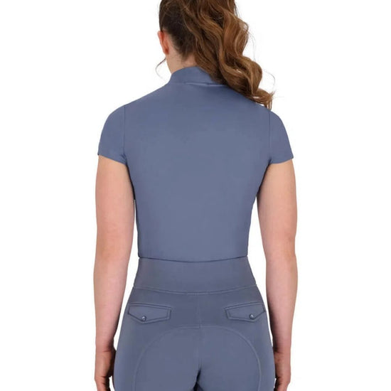 Person wearing a blue short sleeve equestrian outfit on a white background equestrian fashion outfitters