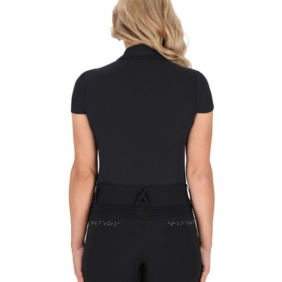 Person wearing a black training short sleeve shirt and breeches with a belt on a white background equestrian fashion outfitters