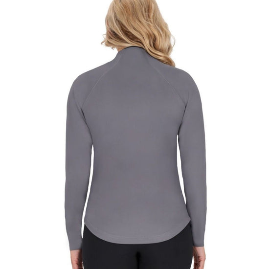 Woman wearing a gray long-sleeve top and black pants on a white background equestrian fashion outfitters