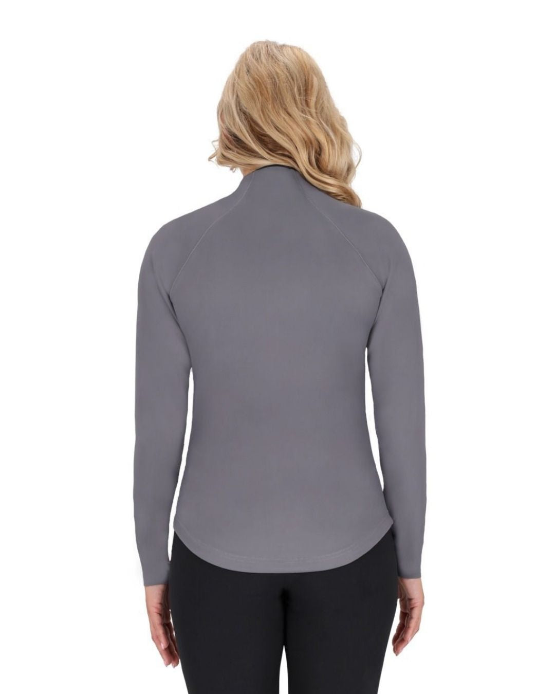 Woman wearing a gray long-sleeve top and black pants on a white background equestrian fashion outfitters