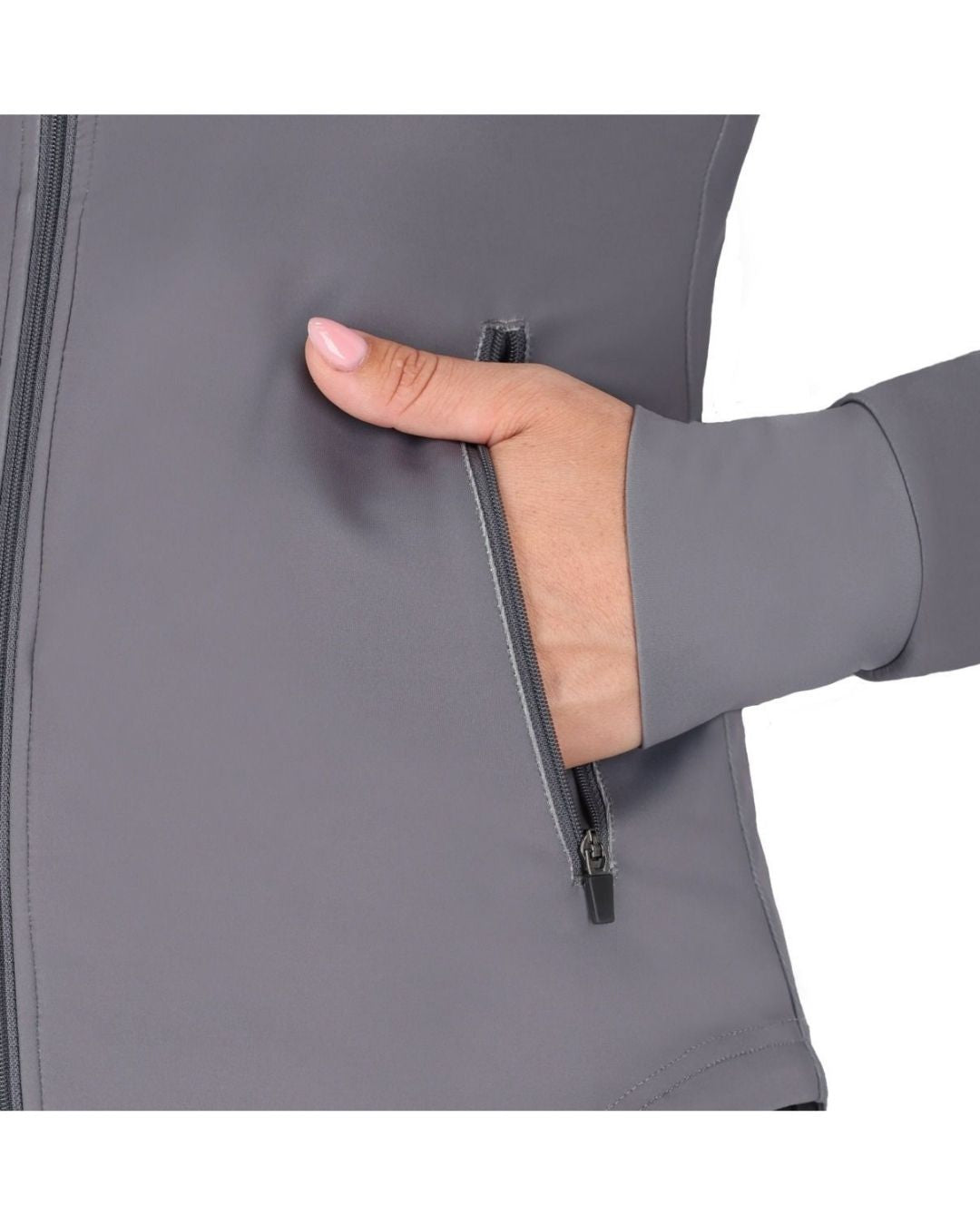 Hand zipping a gray jacket on a white background equestrian fashion outfitters