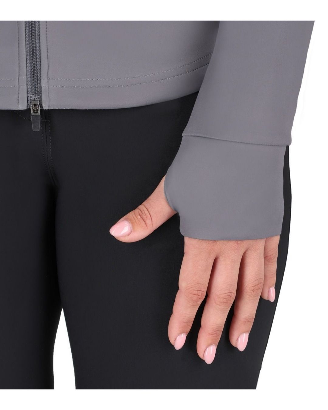 Close-up of a hand wearing a gray sleeve with a black pant background equestrian fashion outfitters