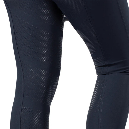 Close-up of dark navy breeches with a silicone  pattern on a white background. equestrian fashion outfitters