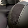 Close-up of black crystal glitter black riding helmet with a blurred background equestrian fashion outfitters