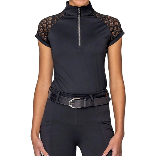 Woman wearing a black equestrian outfit with lace sleeves on a white background kastel equestrian fashion outfitters